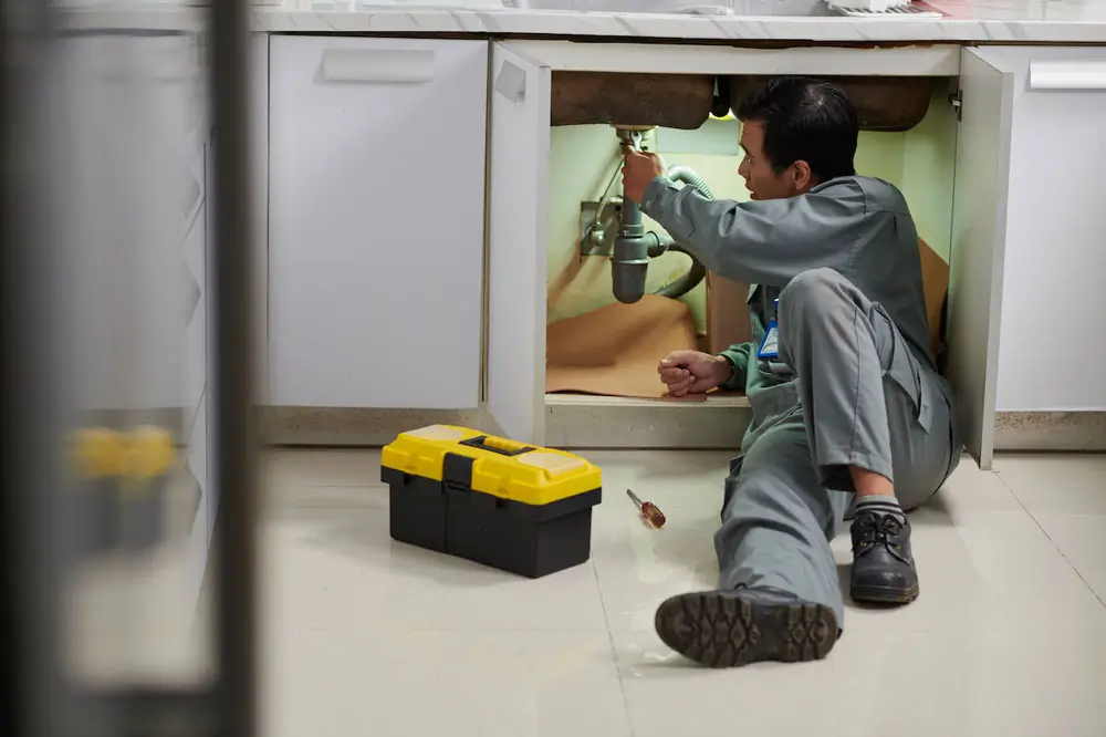 plumber fixing leaking sink 2023 11 27 05 10 17 utc 1