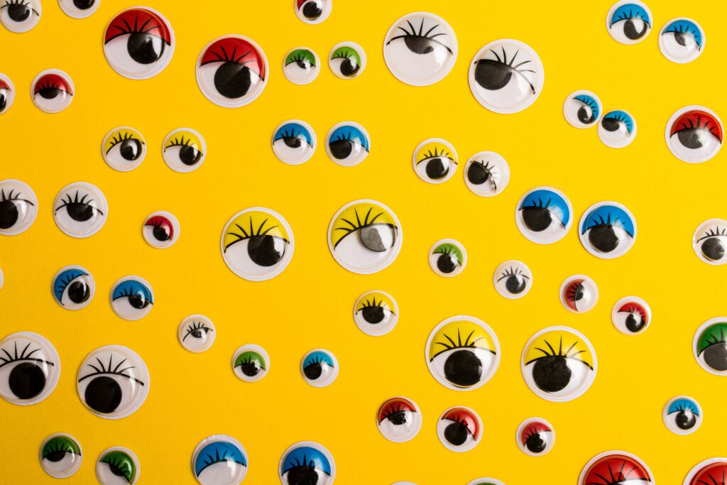 Several googly eyes on a yellow background, emphasising that the Baader-Meinhof phenomenon is when you learn about something new and then start seeing it everywhere.