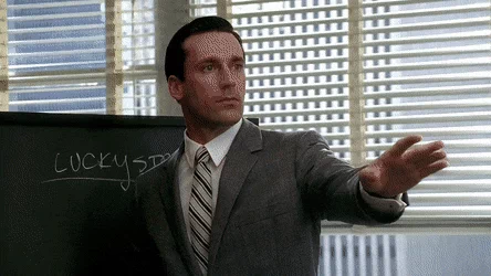Image a gif featuring a scene from mad men, illustrating a marketing tactic related to the perceived scarcity effect, where urgency is created to drive consumer action.
